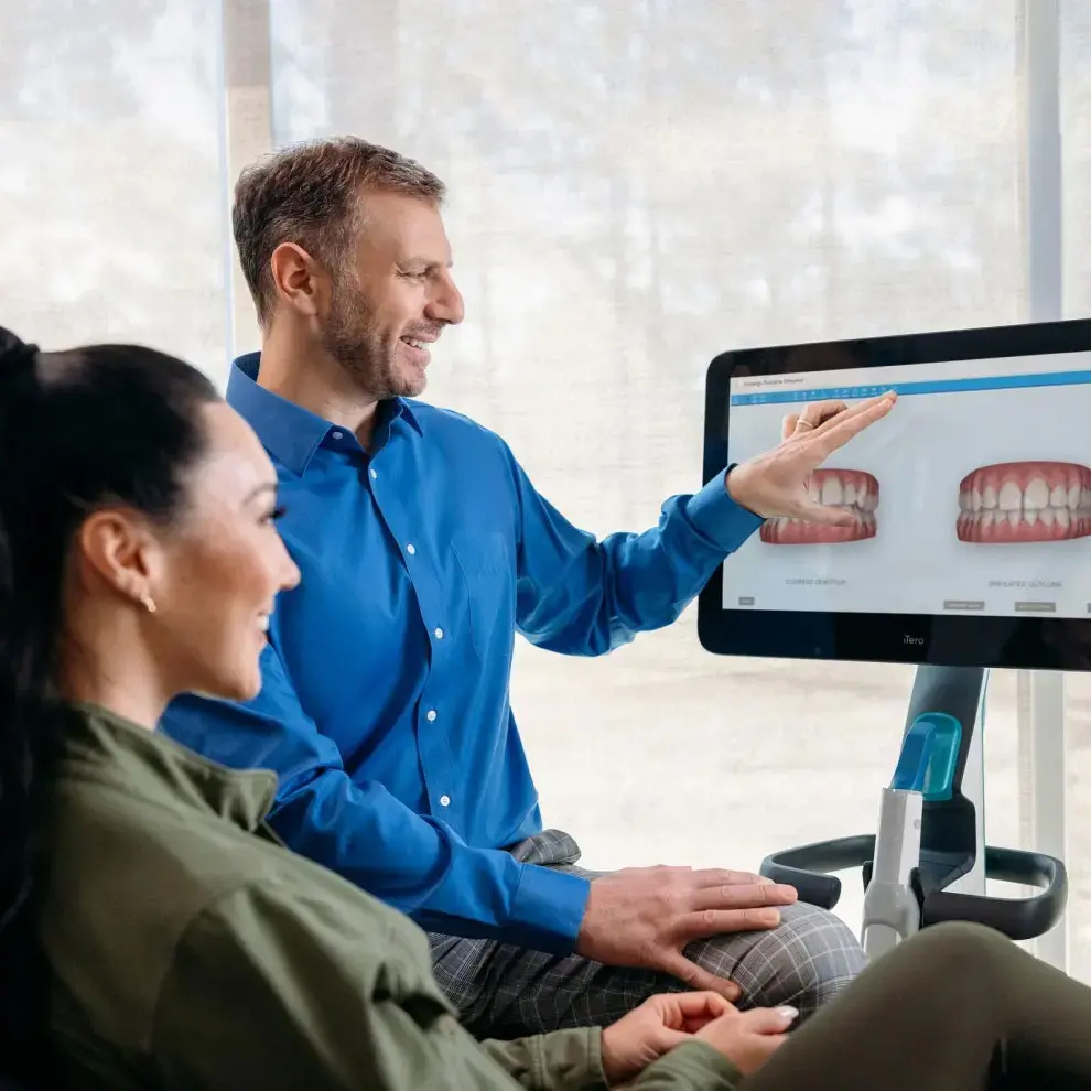 Dentist discussing a digital Invisalign treatment plan