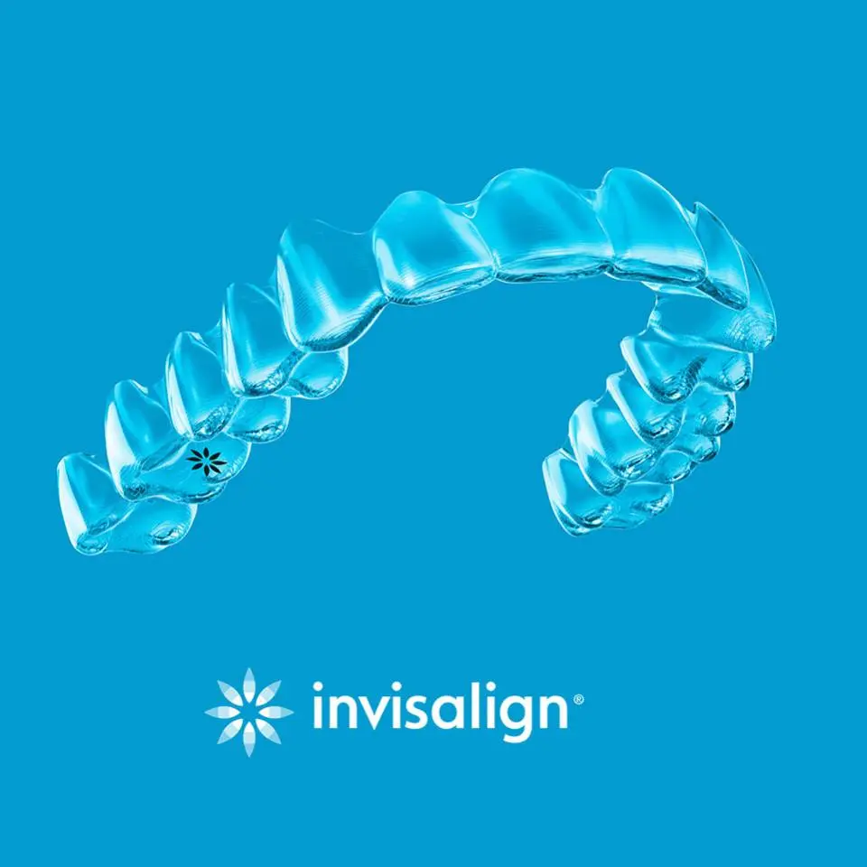 Clear Invisalign aligner on a blue background